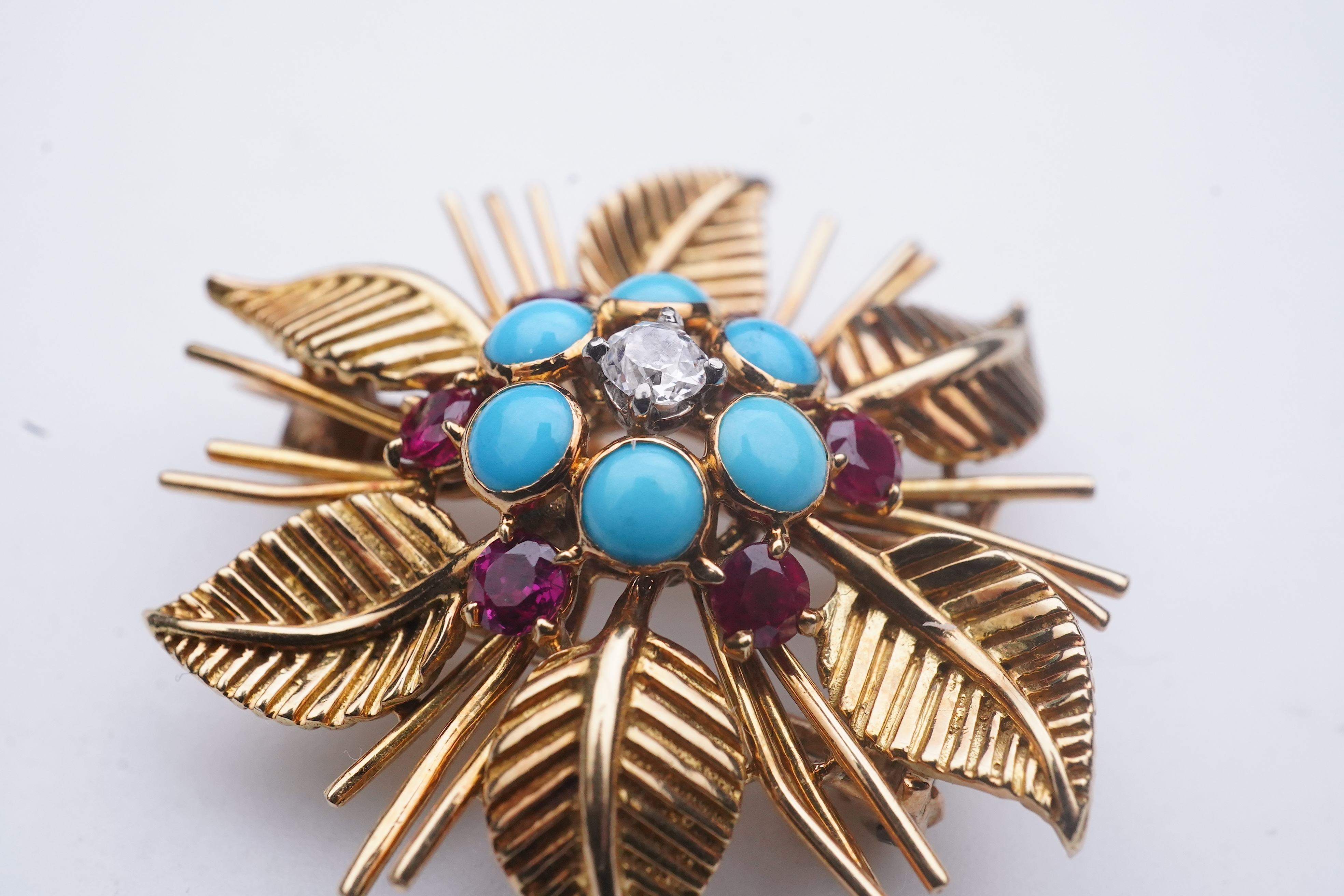 Chaumet, a turquoise, ruby and diamond brooch, mid 20th century